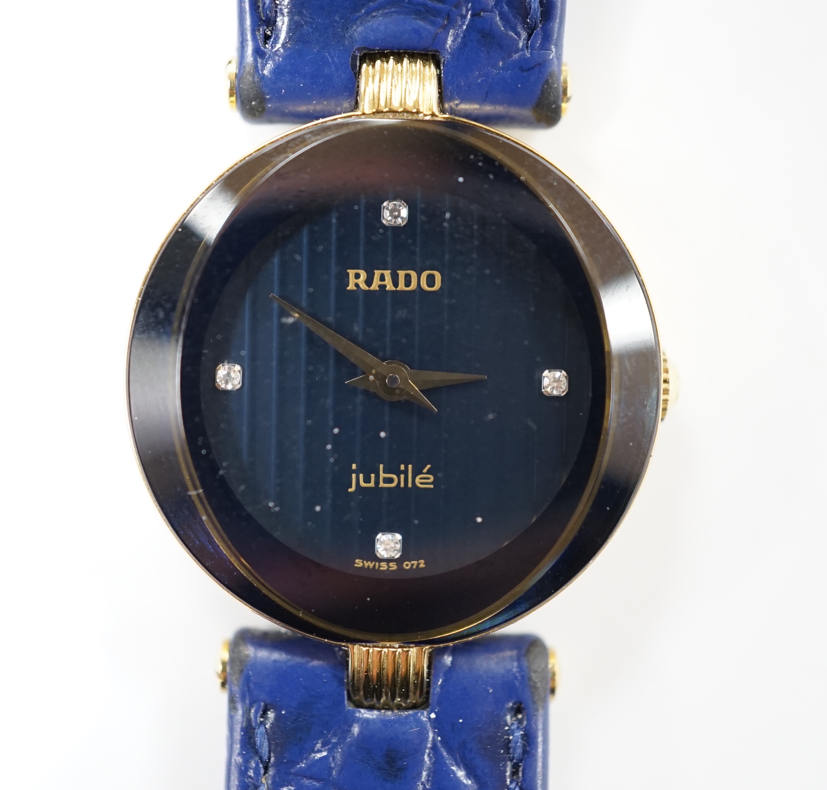 A lady's modern steel and gold plated Rado Jubile quartz wrist watch, Rado strap and spare black Rado strap, with Rado box.